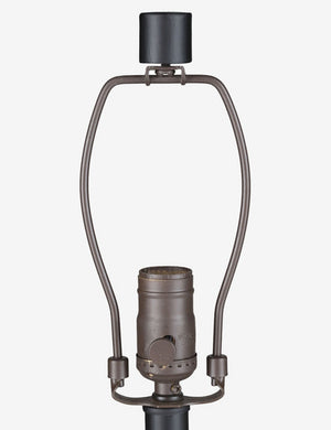 Close-up of the light fixture on the Coulwood black table lamp with sculptural base