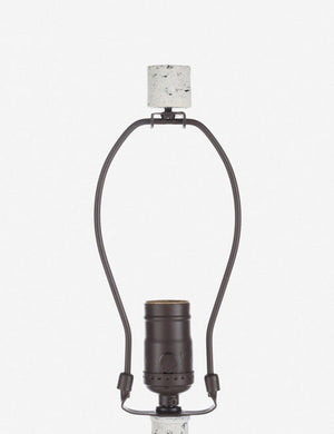 Close-up of the light fixture on the Coulwood ivory table lamp with sculptural base