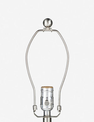 Close-up of the silver light fixture on the Vivienne tan ceramic table lamp with spherical base